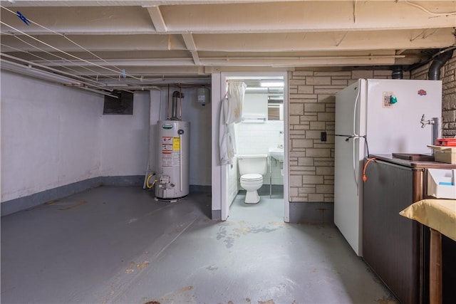 2509 Spring St, Arlington, PA 15210 - basement with water heater and freestanding refrigerator