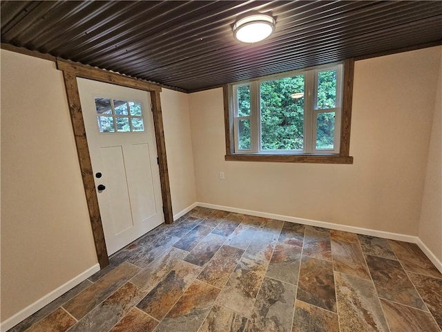 946 Herman Rd, Summit Twp But, PA 16002 - entryway featuring baseboards and stone tile floors