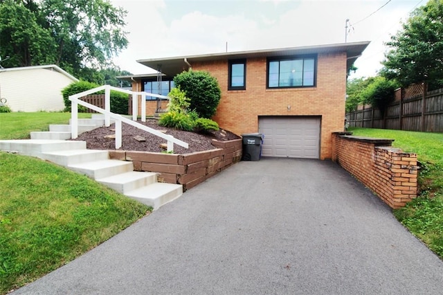 202 Dominican Way, Zelienople Boro, PA 16063 - view of front of house with a garage, brick siding, and asphalt driveway