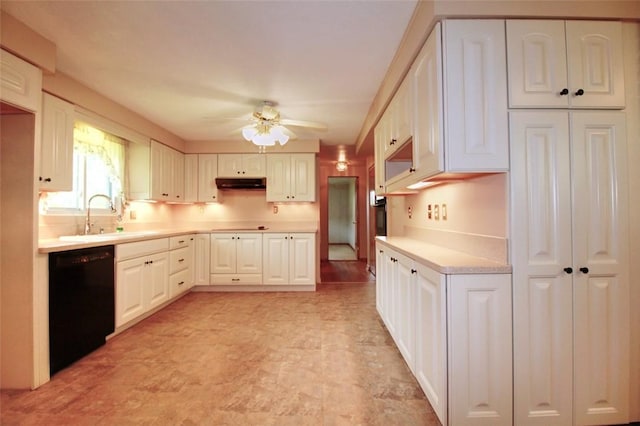202 Dominican Way, Zelienople Boro, PA 16063 - kitchen with black appliances, under cabinet range hood, ceiling fan, light countertops, and white cabinetry