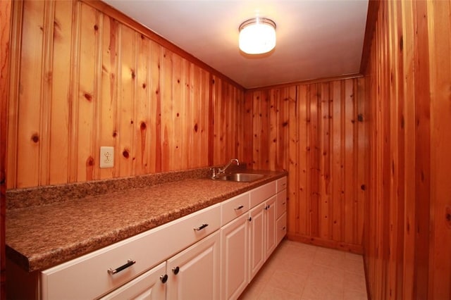202 Dominican Way, Zelienople Boro, PA 16063 - kitchen with wooden walls, white cabinets, and light tile patterned floors
