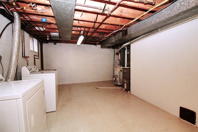 202 Dominican Way, Zelienople Boro, PA 16063 - basement featuring washer and clothes dryer, gas water heater, light flooring, and concrete block wall
