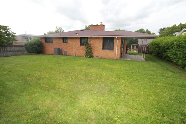 202 Dominican Way, Zelienople Boro, PA 16063 - rear view of property with a chimney and brick siding