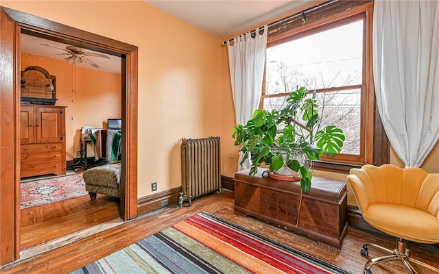 609 N Beatty, East Liberty, PA 15206 - sitting room with radiator heating unit, a ceiling fan, and wood finished floors