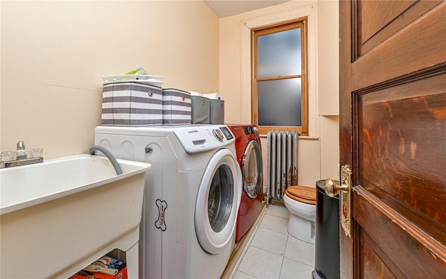 609 N Beatty, East Liberty, PA 15206 - laundry area featuring radiator heating unit, light tile patterned flooring, and washing machine and dryer