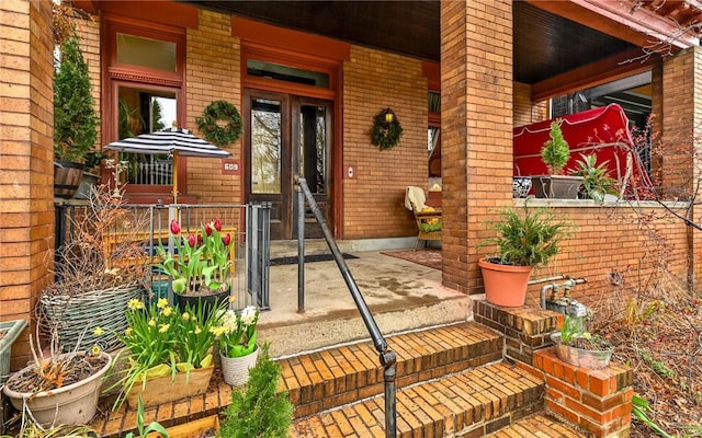 609 N Beatty, East Liberty, PA 15206 - doorway to property featuring a porch and brick siding