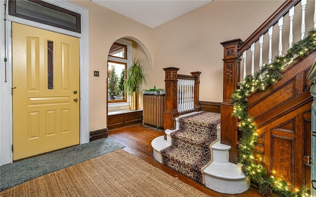 609 N Beatty, East Liberty, PA 15206 - entrance foyer featuring stairway, dark wood-type flooring, and arched walkways