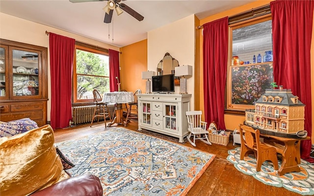 609 N Beatty, East Liberty, PA 15206 - sitting room with radiator, a ceiling fan, and wood finished floors