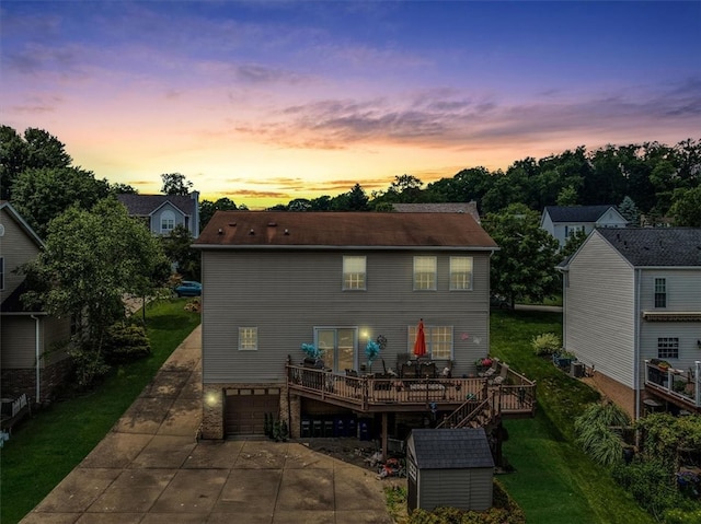 2616 Chalet Ln, South Park, PA 15129 - back of house featuring concrete driveway, a garage, a deck, and a lawn