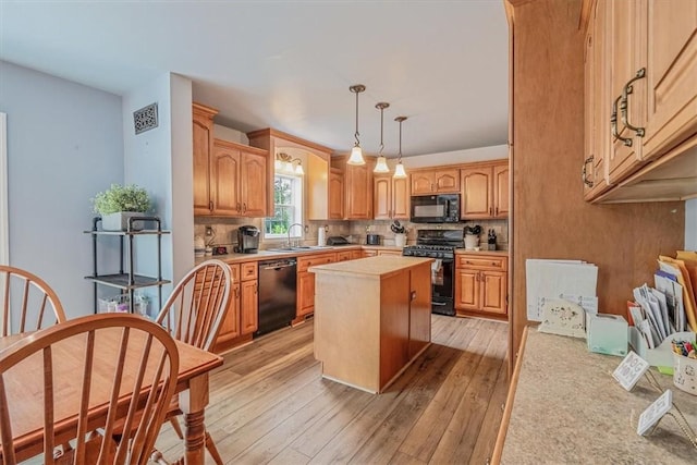 2616 Chalet Ln, South Park, PA 15129 - kitchen with black appliances, light countertops, tasteful backsplash, and light wood-style floors