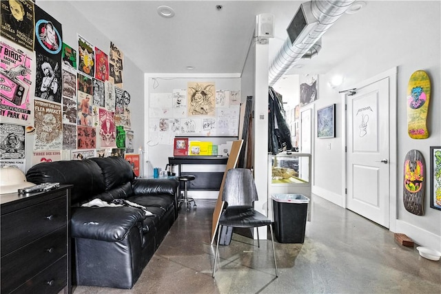 3105 Brereton St, Lawrenceville, PA 15219 - living room featuring finished concrete floors and baseboards