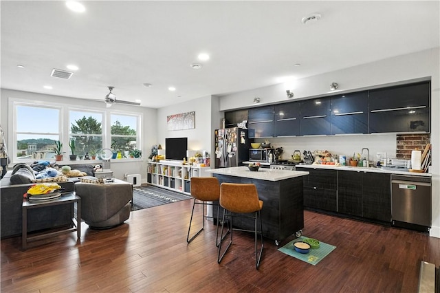 3105 Brereton St, Lawrenceville, PA 15219 - kitchen with appliances with stainless steel finishes, modern cabinets, open floor plan, a center island, and a breakfast bar