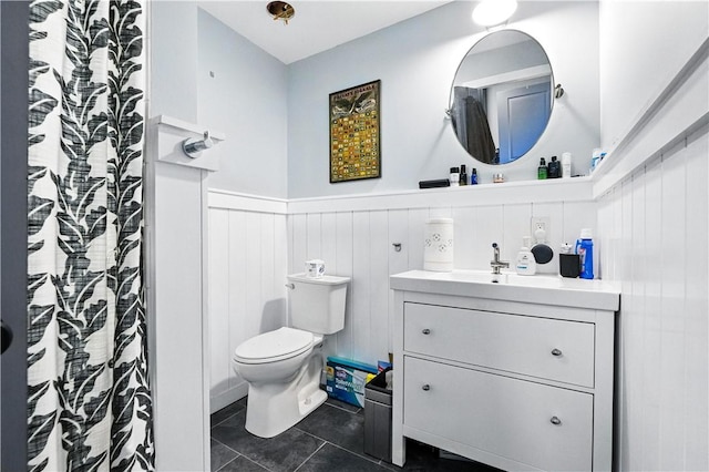 3105 Brereton St, Lawrenceville, PA 15219 - bathroom featuring vanity, a wainscoted wall, tile patterned floors, and a shower with shower curtain