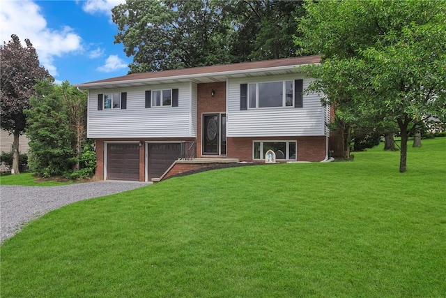 285 Old Plank Rd, City Of But Se, PA 16002 - split foyer home with gravel driveway, an attached garage, a front lawn, and brick siding