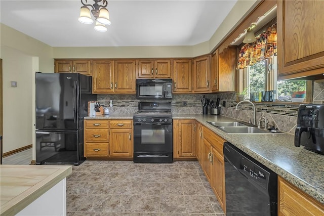 285 Old Plank Rd, City Of But Se, PA 16002 - kitchen with black appliances, brown cabinetry, backsplash, and a chandelier