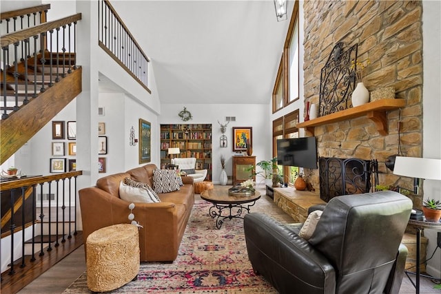 10737 Babcock Blvd, Pine Twp Nal, PA 15044 - living room with high vaulted ceiling, wood finished floors, stairs, and a fireplace