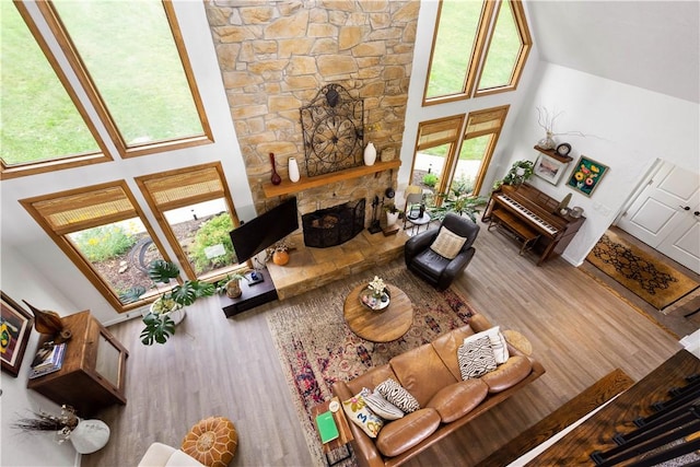 10737 Babcock Blvd, Pine Twp Nal, PA 15044 - living room featuring a towering ceiling, a stone fireplace, and wood finished floors