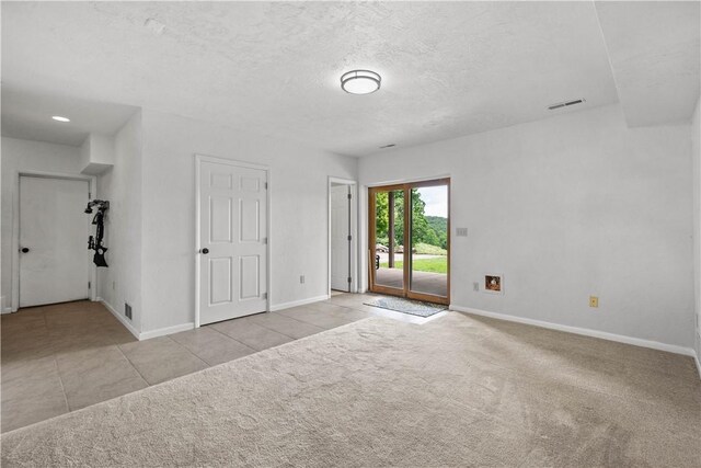 10737 Babcock Blvd, Pine Twp Nal, PA 15044 - unfurnished room with carpet flooring, tile patterned floors, and a textured ceiling