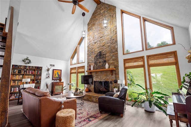 10737 Babcock Blvd, Pine Twp Nal, PA 15044 - living area featuring high vaulted ceiling, wood finished floors, a ceiling fan, healthy amount of natural light, and beamed ceiling