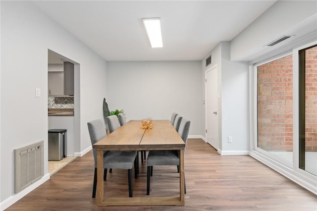 307 S Dithridge St Unit 207, Oakland, PA 15213 - dining area with wood finished floors and baseboards
