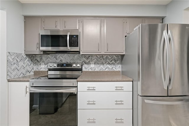 307 S Dithridge St Unit 207, Oakland, PA 15213 - kitchen featuring appliances with stainless steel finishes, gray cabinets, and decorative backsplash