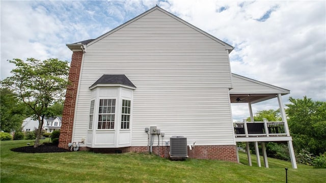 104 Cherokee Ct, Buffalo Twp But, PA 16229 - view of side of home with a ceiling fan, a lawn, and a deck
