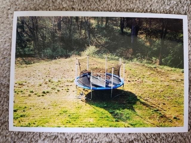 104 Cherokee Ct, Buffalo Twp, PA 16229 - view of green lawn with a trampoline