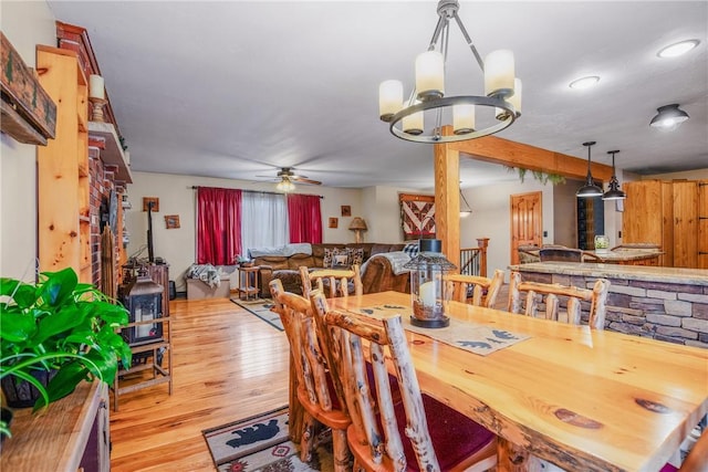 4627 Water Level Rd, Milford Twp, PA 15557 - dining area with wood finished floors, a ceiling fan, and a chandelier
