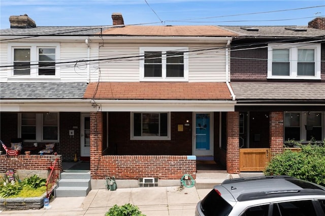 4207 Post St, Lawrenceville, PA 15201 - multi unit property featuring covered porch, brick siding, and roof with shingles