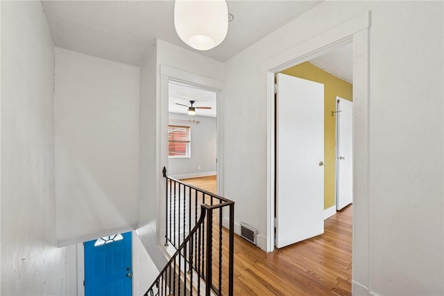 4207 Post St, Lawrenceville, PA 15201 - corridor with an upstairs landing and wood finished floors