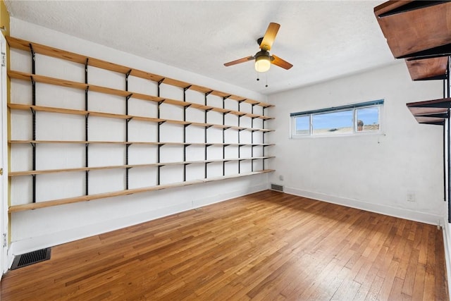 4207 Post St, Lawrenceville, PA 15201 - unfurnished room with hardwood / wood-style flooring, a ceiling fan, and a textured ceiling