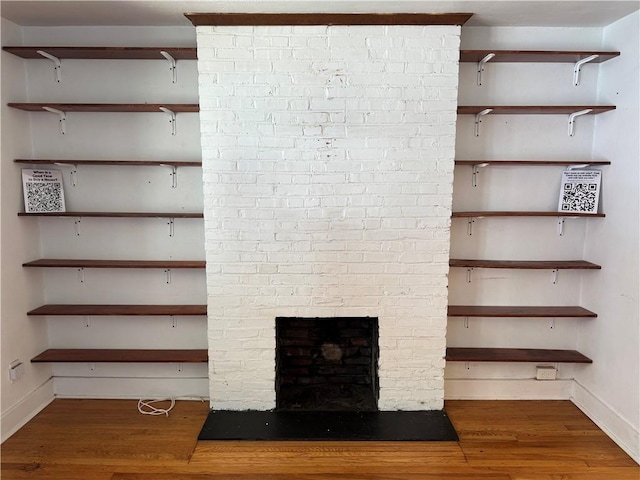 4207 Post St, Lawrenceville, PA 15201 - detailed view of wood finished floors and a fireplace