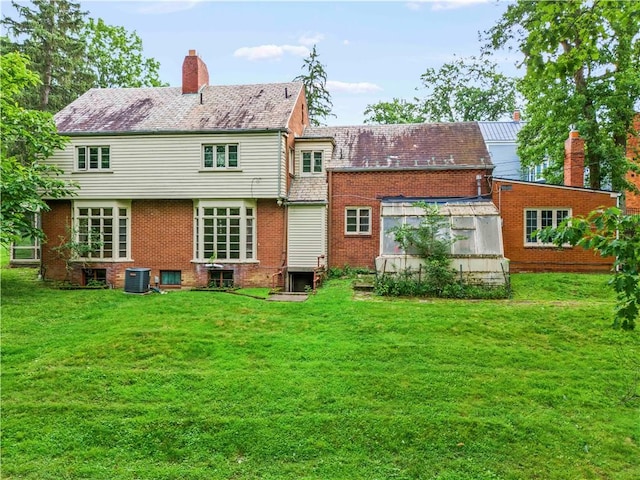 35 Redstone Ln, City Of Washington, PA 15301 - rear view of house with a yard, brick siding, and a chimney
