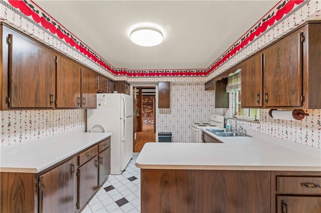 35 Redstone Ln, City Of Washington, PA 15301 - kitchen featuring white appliances, wallpapered walls, light countertops, light floors, and a peninsula