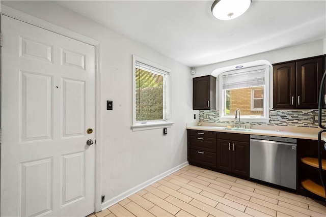 2401 Valera Ave, Carrick, PA 15210 - kitchen featuring stainless steel dishwasher, decorative backsplash, and light countertops