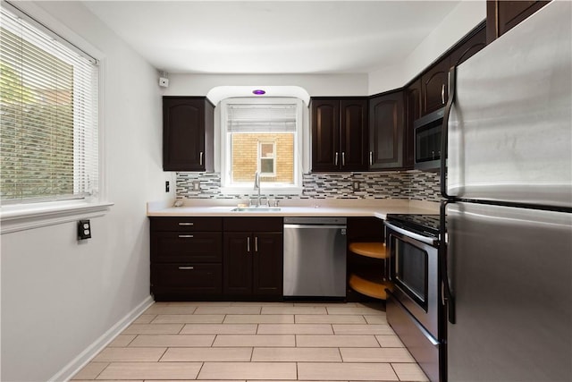 2401 Valera Ave, Carrick, PA 15210 - kitchen featuring appliances with stainless steel finishes, tasteful backsplash, light countertops, and dark brown cabinets