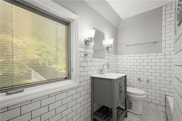 2401 Valera Ave, Carrick, PA 15210 - full bath with tile walls, vanity, tile patterned flooring, a wainscoted wall, and a tub