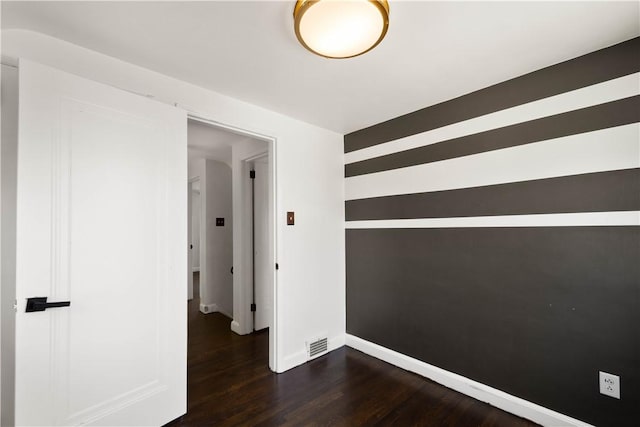 2401 Valera Ave, Carrick, PA 15210 - empty room featuring dark wood-type flooring and baseboards
