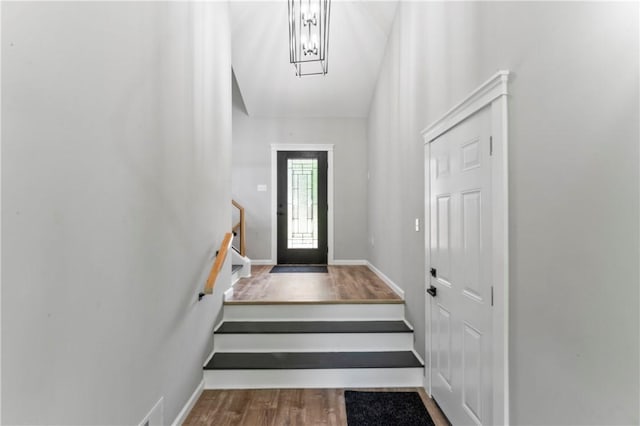 117 Heather Dr, Center Twp Bea, PA 15061 - doorway to outside featuring wood finished floors, stairway, and a chandelier