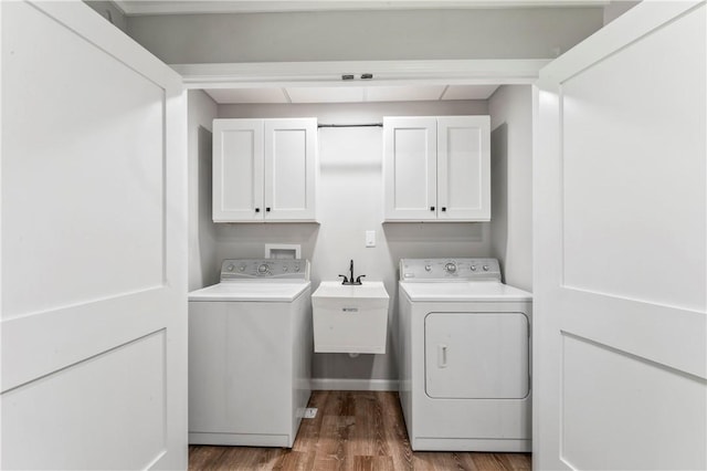 117 Heather Dr, Center Twp Bea, PA 15061 - washroom with cabinet space, washing machine and clothes dryer, and wood finished floors