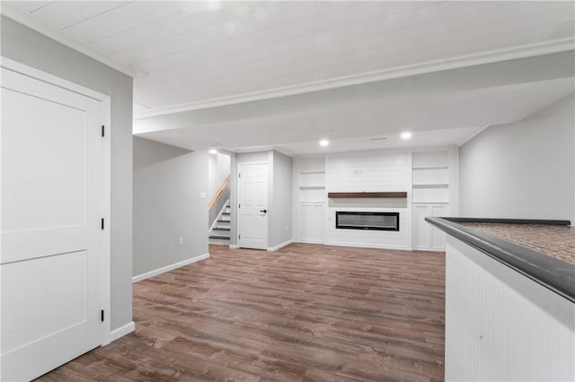 117 Heather Dr, Center Twp Bea, PA 15061 - unfurnished living room with stairs, dark wood-style flooring, a glass covered fireplace, built in shelves, and recessed lighting