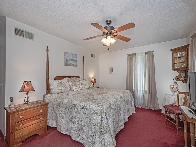 4779 State Route 819, Bell Twp, PA 15613 - bedroom featuring dark carpet, a textured ceiling, and a ceiling fan