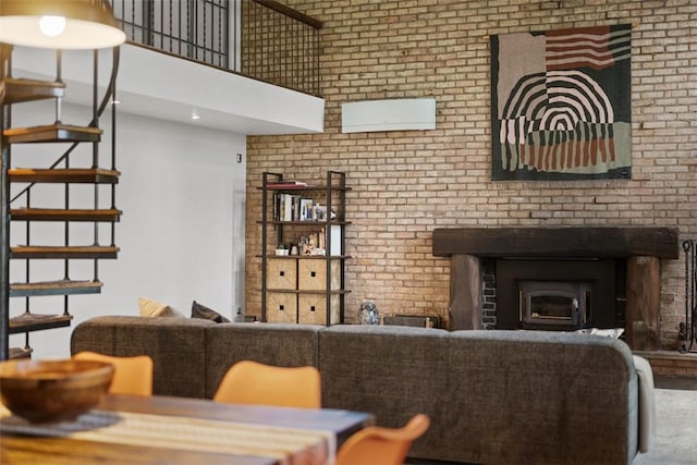287 Rankin Rd, Belle Vernon, PA 15012 - living room with a towering ceiling, brick wall, and stairs