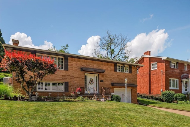 4636 Bowes Ave, West Mifflin, PA 15122 - split foyer home with an attached garage, a chimney, and a front yard