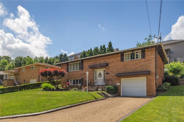 4636 Bowes Ave, West Mifflin, PA 15122 - split foyer home with a garage, driveway, a front lawn, and brick siding