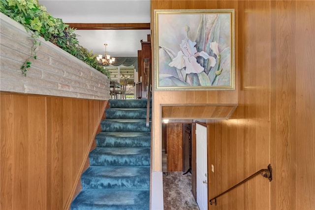 4636 Bowes Ave, West Mifflin, PA 15122 - staircase with wood walls, carpet flooring, and a chandelier