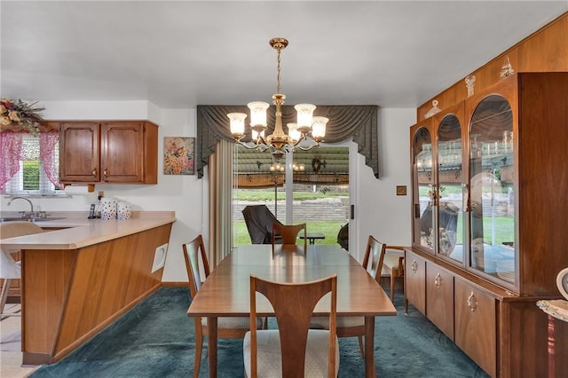 4636 Bowes Ave, West Mifflin, PA 15122 - dining room with a chandelier and dark colored carpet