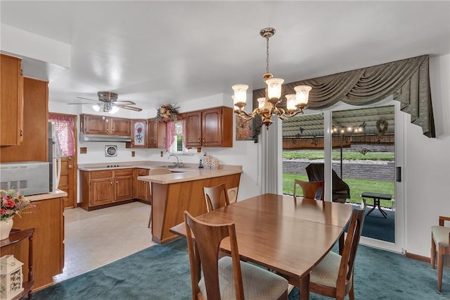4636 Bowes Ave, West Mifflin, PA 15122 - dining space featuring a chandelier, healthy amount of natural light, and ceiling fan