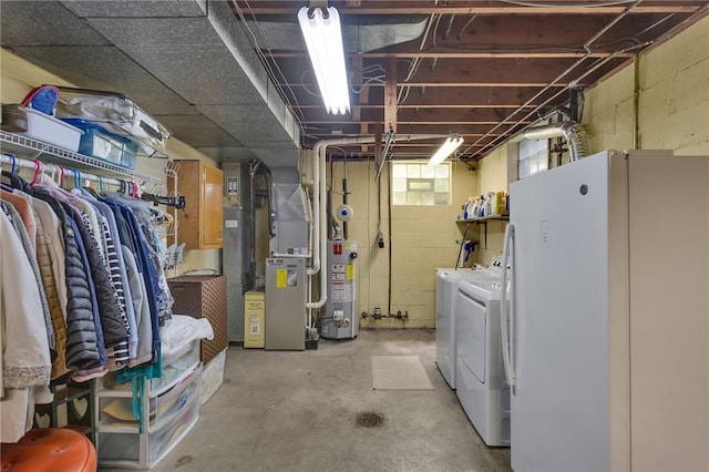 4636 Bowes Ave, West Mifflin, PA 15122 - below grade area featuring gas water heater, freestanding refrigerator, washer and dryer, and heating unit