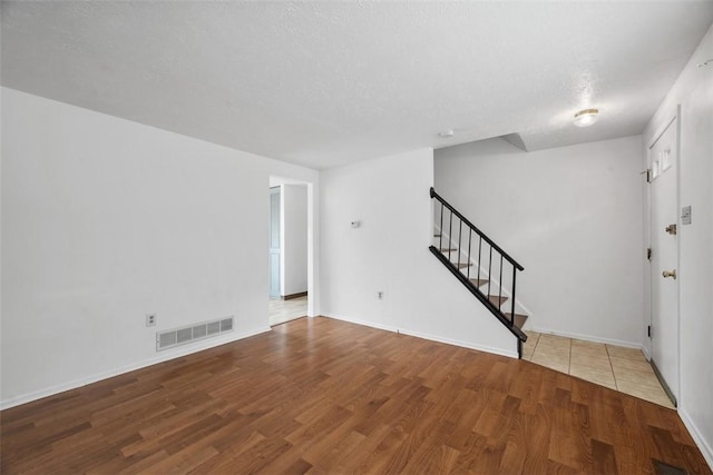 305 Laporte Ct, Cranberry Twp, PA 16066 - unfurnished room with stairs and wood finished floors